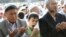 A boy yawns during Islamic prayers at a square in the Kyrgyz capital, Bishkek.