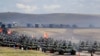 RUSSIA -- Chinese tanks roll during a military exercises on training ground "Tsugol", about 250 kilometers (156 miles ) south-east of the city of Chita during the military exercises Vostok 2018 in Eastern Siberia, September 13, 2018. File photo