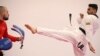 Iranian tae kwon do competitor Farzad Zolghadri practices with Bulgarian national tae kwon do coach Teodor Georgiev during a training session in Sofia on January 30.