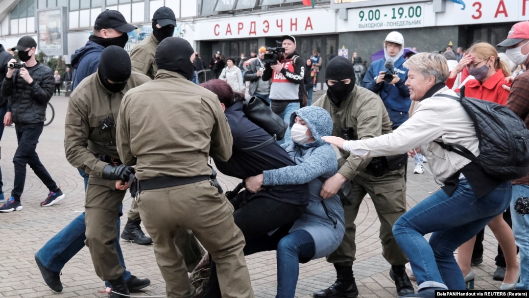Law enforcement officers drag a demonstrator during a rally in support of detained Belarusian opposition leader Maryya Kalesnikava in Minsk in September 2020. 
