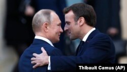 France - French President Emmanuel Macron, right, welcomes Russian President Vladimir Putin at the Elysee Palace in Paris, December 9, 2019 