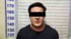 Кармалган блогер жана активист Айбек Уланов. Милиция тараткан сүрөт.