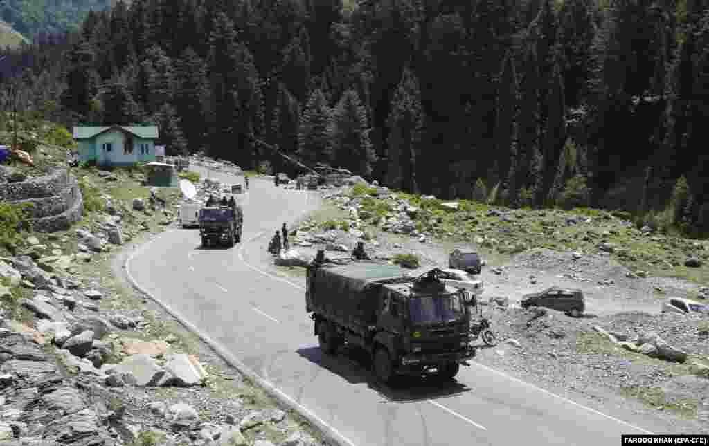 Indian army trucks move along a highway leading to Ladakh, at Gagangeer some 81 kilometers from Srinagar, the summer capital of Indian Kashmir, 17 June 2020.