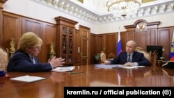 Putin meets with Veronika Skvortsova, head of the FMBA, in August.