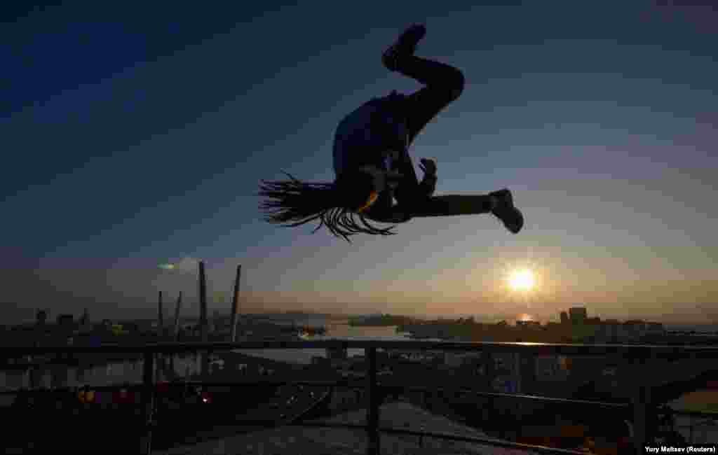 Andrei Bocharnikov practices parkour in front of Golden Horn Bay in the city of Vladivostok, Russia. (Reuters/Yuri Maltsev)