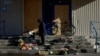 A woman sells vegetables on the steps of a closed supermarket amid Russia's attack on Ukraine in Pokrovsk in Ukraine's eastern Donetsk region on October 28.