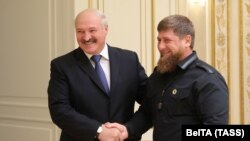 Belarusian President Alyaksandr Lukashenka (left) shakes hands with Ramzan Kadyrov, the leader of Russia's Chechen region in Minsk on September 25.