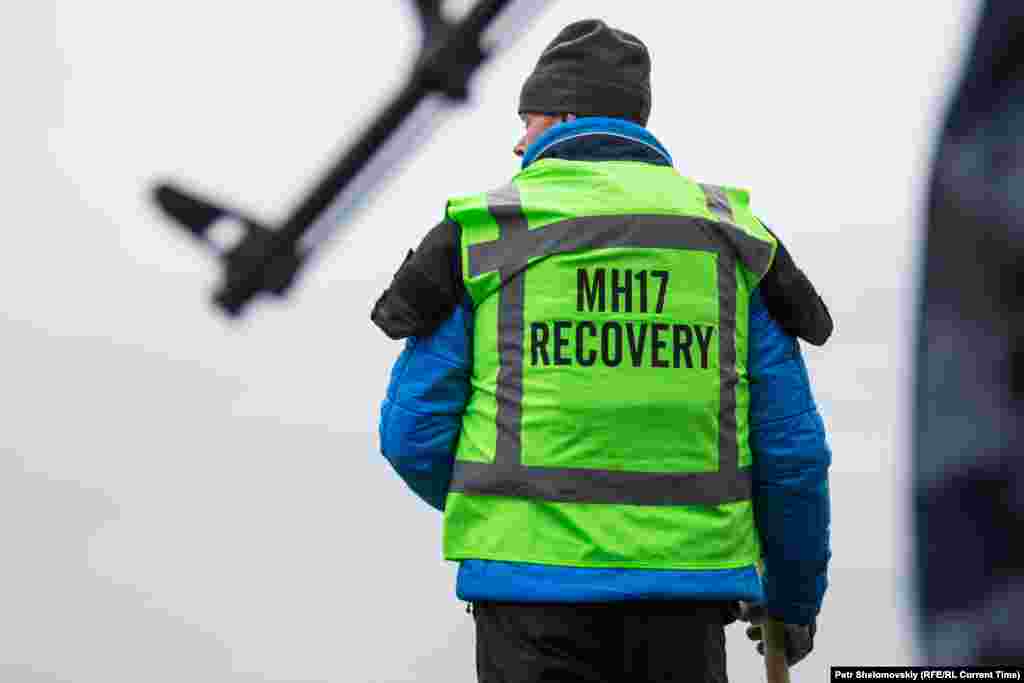 Dutch investigators inspect the wreckage. The flight departed from Amsterdam with mostly Dutch passengers on board.