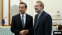  علی لاریجانی در دیدار با وانگ یی، وزیر خارجه چین 