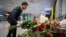 Ukrainian President Volodymyr Zelenskiy lays flowers at a memorial to the crash victims at Kyiv's Boryspil International Airport. 