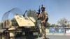 A member of the Afghan security forces keeps watch at the site of an attack in Kabul, Afghanistan on August 21.