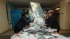 Kazakhstan -- Members of a local election committee empty a ballot box to count votes after a snap parliamentary election in Kyzylorda, March 20, 2016