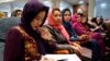 Afghan women attend a consultative grand assembly, known as a Loya Jirga, in Kabul. While they have gained rights like those to vote and to work, they are still faced with a patriarchy that denies them the right to their names.