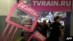 Journalists gather for a press conference by the co-owners of embattled cable channel Dozhd (TV Rain), Natalya Sindeyeva and Aleksandr Vinokurov, at the channel office in Moscow on February 4.