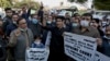 Members of the Pakistani Hindu Council hold a protest in Karachi on December 31 against the attack on a Hindu temple in the northwestern Karak district.