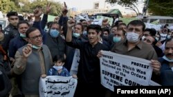 Members of the Pakistani Hindu Council hold a protest in Karachi on December 31 against the attack on a Hindu temple in the northwestern Karak district.