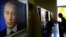 Russian President Vladimir Putin on a computer screen in an Internet cafe in Moscow.
