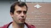 Roman Dobrokhotov leaves a police station in Moscow on July 28.