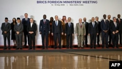 Foreign ministers of the BRICS countries and invited guests pose during their summit in Delhi.