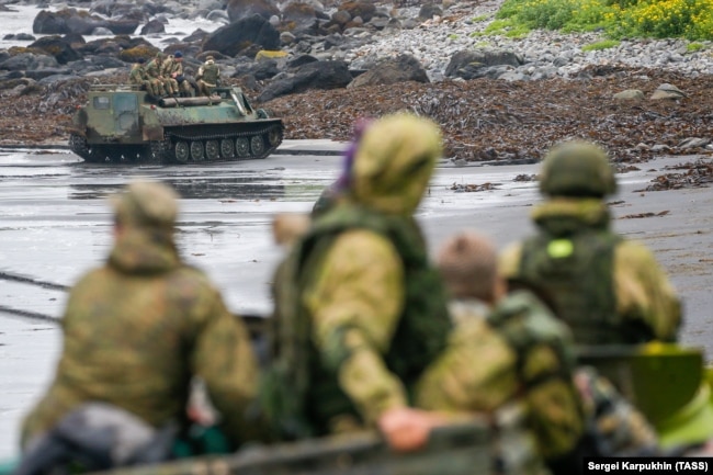 Tracked vehicles crawl along a beach on Iturup Island, one of the southernmost of the Kuriles. Iturup is one of several of the islands that are the subject of a seven-decade territorial dispute between Russia and Japan.