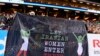 (FILE) Supporters hold a banner reading 'Let Iranian women enter their stadiums' during the friendly international football match between Sweden and Iran near Stockholm, March 31, 2015