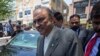 Former Pakistani president and currently a lawmaker in Parliament and leader of Pakistan People's party, Asif Ali Zardari, center, leaves the High Court building, in Islamabad on June 10.