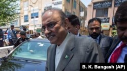 Former Pakistani president and currently a lawmaker in Parliament and leader of Pakistan People's party, Asif Ali Zardari, center, leaves the High Court building, in Islamabad on June 10.