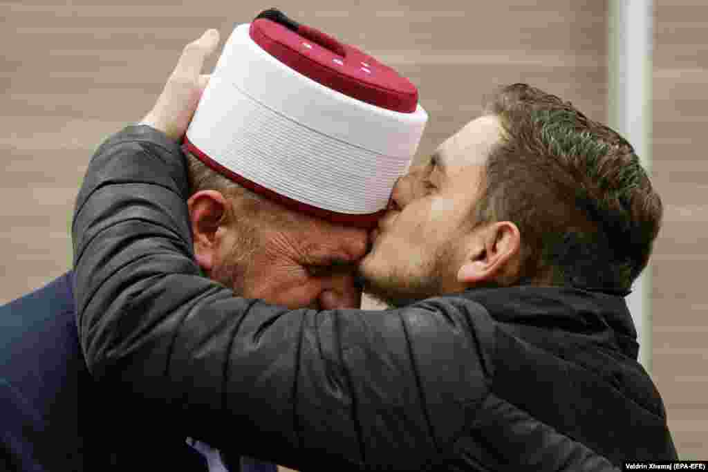 A supporter kisses imam Shefqet Krasniqi (left) after he was acquitted in a Kosovar court after being accused of terror and hate speech. Kosovo, with its 1.8-million predominantly Muslim population, has been a major source of foreign fighters, with some 350 joining extremist groups in Syria and Iraq. (epa-EFE/Valdrin Xhemaj)