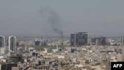 Стовп диму піднімається після перехоплення безпілотника в Ербілі 12 березня 2026 року