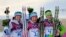 Norway's Maiken Caspersen Falla (center) celebrates winning the gold medal next to silver medalist Ingvild Flugstad Oestberg (left) of Norway and bronze medalist Vesna Fabjan (right) of Slovenia after the women's cross-country freestyle sprint race on February 11. 