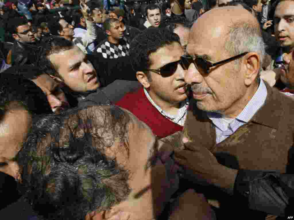 Muhammad El-Baradei is surrounded by demonstrators in Cairo on January 28.