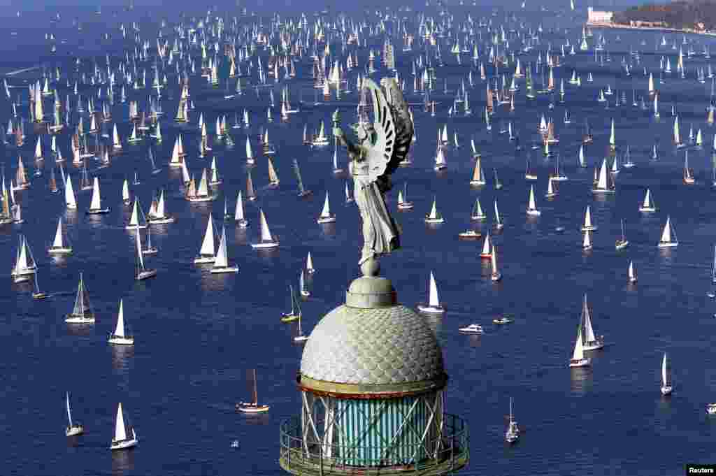 Sailing boats gather at the start of the Barcolana regatta in front of Trieste harbor, Italy, on October 9. (Reuters/Stefano Rellandini)