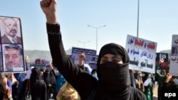 FILE: Afghanistan activists protest against the former warlords and communist regimes of the 1980s and 1990s.
