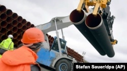 Steel pipes for the Nord Stream 2 pipeline are uploaded in Mukran harbor in Sassnitz, Germany.