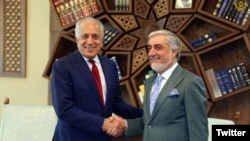 Afghan Chief Executive Officer Abdullah Abdullah (right) meets with Zalmay Khalilzad, the U.S. envoy seeking a peace deal with the Taliban, in Kabul on April 3.