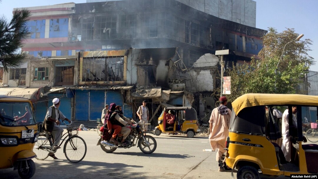 Damaged shops are seen after fighting between the Taliban and Afghan security forces in Kunduz city on August 8.