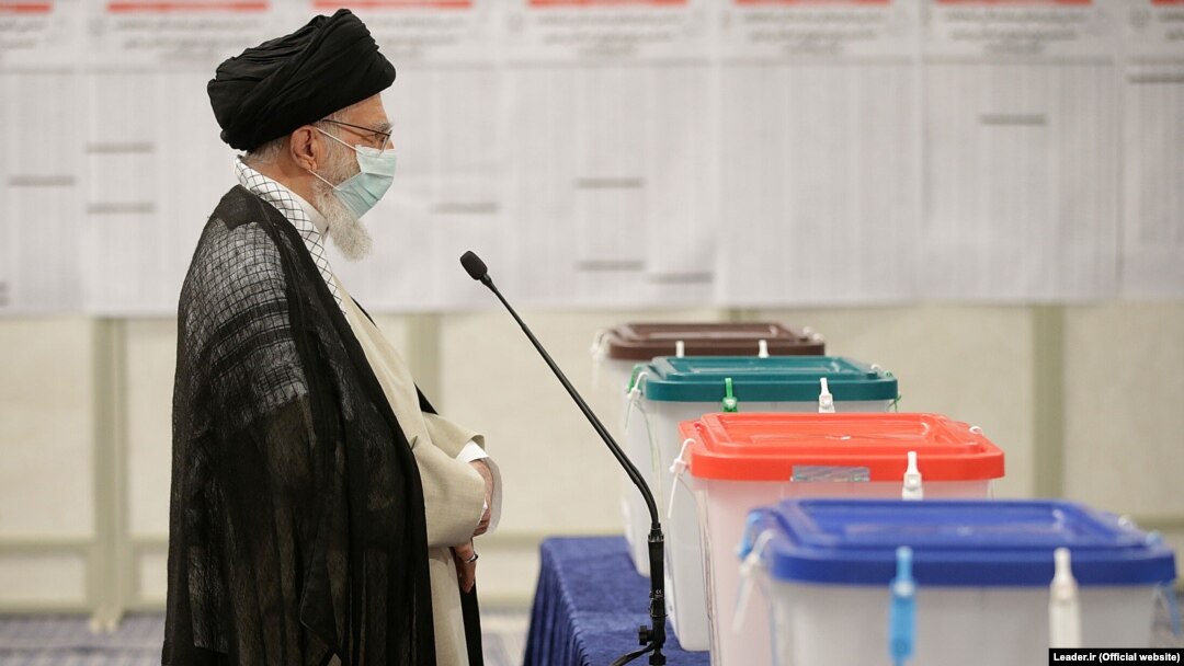 Iran's Supreme Leader Ayatollah Ali Khamenei speaks to reporters after casting his vote during the Iranian presidential election in Tehran in June 2021.