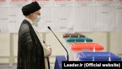 Iran's Supreme Leader Ayatollah Ali Khamenei speaks to reporters after casting his vote during the Iranian presidential election in Tehran in June 2021.