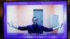 Russian opposition leader Aleksei Navalny is seen on a screen during a video court hearing on January 28 to consider an appeal on his arrest. 