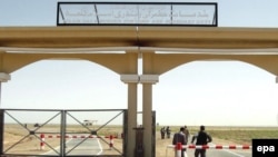 Afghan customs officers man a checkpoint at the Iranian border. But Iran's influence in Afghanistan is felt in more than just commerce.