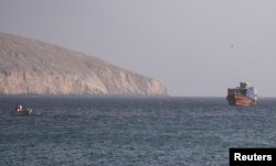A vessel in the Strait of Hormuz, as seen from Musandamm Oman, on July 16.