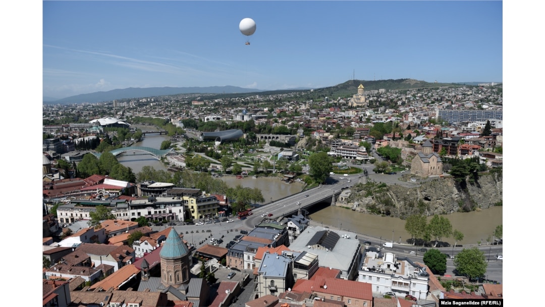 A picturesque view of Tbilisi from the Narikala fortress with the meandering Kura River.