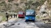 Security personnel inspect the site of a suicide attack Pakistan's Khyber Pakhtunkhwa Province that killed at least six people, including five Chinese workers. 