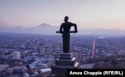 Mount Ararat (left) seen behind Yerevan's Mother Armenia monument