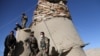 Afghan National Army (ANA) soldiers stand guard at the check post in Khawaja Omari district of Ghazni province on April 12.