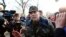 Ukrainian General Vasyl Krutov (center) talks to journalists in front of the air base in Kramatorsk in eastern Ukraine on April 15.