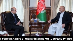 Russian Ambassador Dmitry Zhirnov (left) meets with former Afghan Foreign Minister Mohammad Haneef Atmar in Kabul in March.