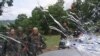 KOSOVO -- Yugoslav Army soldiers stand in front of the car belonging to UCPMB (Liberation army for Bojanovac, Presevo and Medvedja) commander Ridvan Qazimi, known as Commander Lleshi, near the village of Veliki Trnovac, May 25, 2001