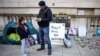 Richard Ratcliffe stands next to his daughter Gabrielle during his hunger strike outside the Foreign, Commonwealth and Development Office in London on October 25.