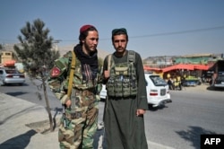 Taliban fighters patrol a street in Kabul on November 2.